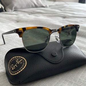 Woman’s gently used Clubmaster Ray Bans